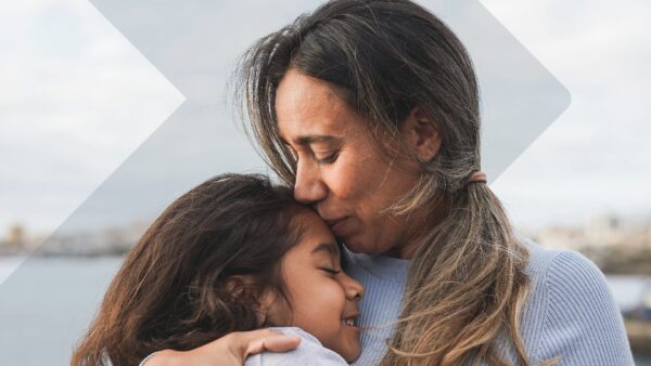 Woman holding daughter.